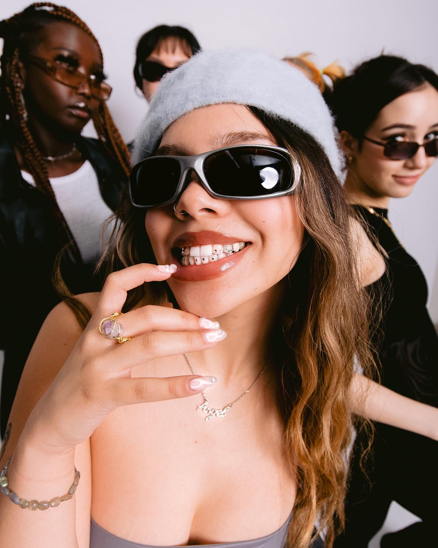 Client portrait with smile jewelry and sunglasses